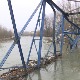 Сузе мештана због моста који пола године тавори у речном кориту,  јер је доказни материјал